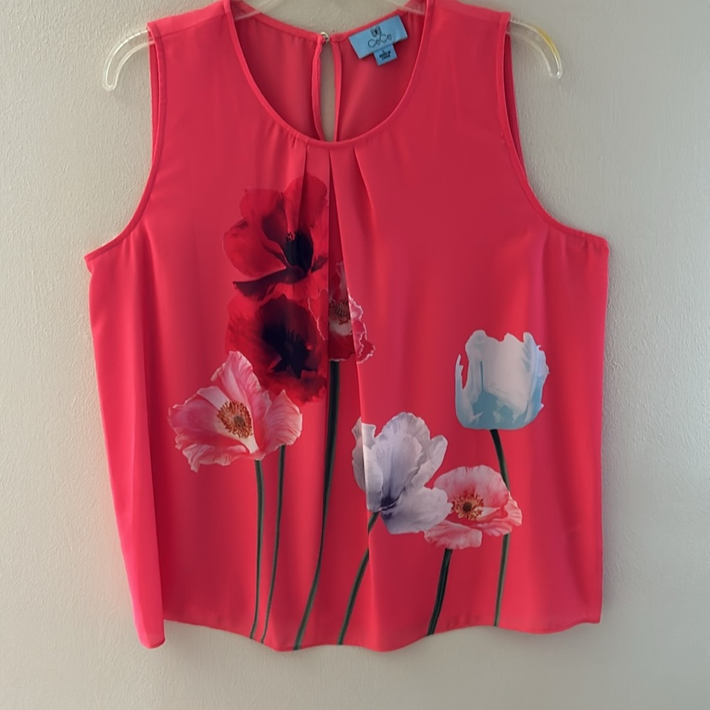 Cece sleeveless blouse. Size large. Coral color with blue,pink & red flowers.